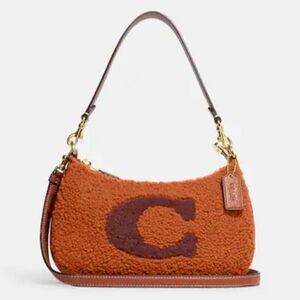 NWT Coach GENUINE SHEARLING teri shoulder bag with coach motif NEW WITH TAG​…
